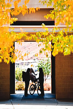 students standing under clocktower