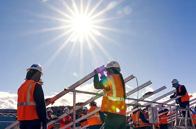 Sustainability leaders are changemakers like these FLC students installing solar panels at Navajo Nation