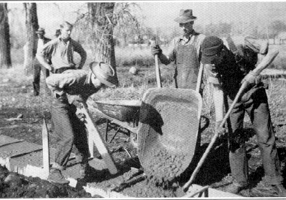 vocational students building sidewalks