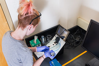 Chemistry student hands-on learning in research lab