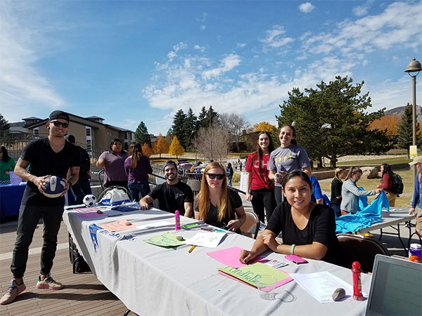 student volunteers manning check in table at Fresh Check Day